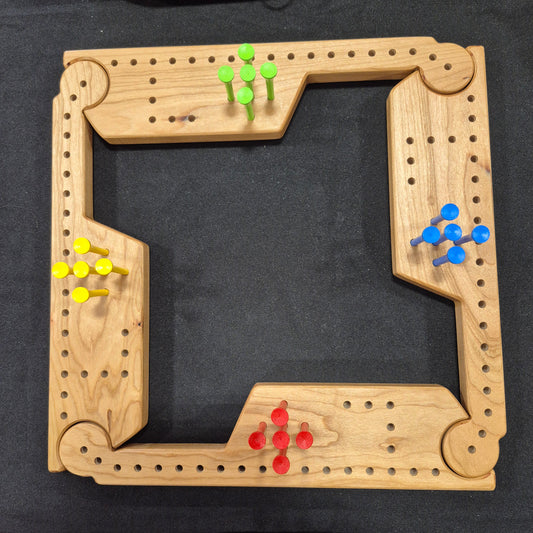 A Wooden, handcrafted Jokers and Pegs Game for up to four players.  The game is easily expanded for up to eight players by adding extra pieces